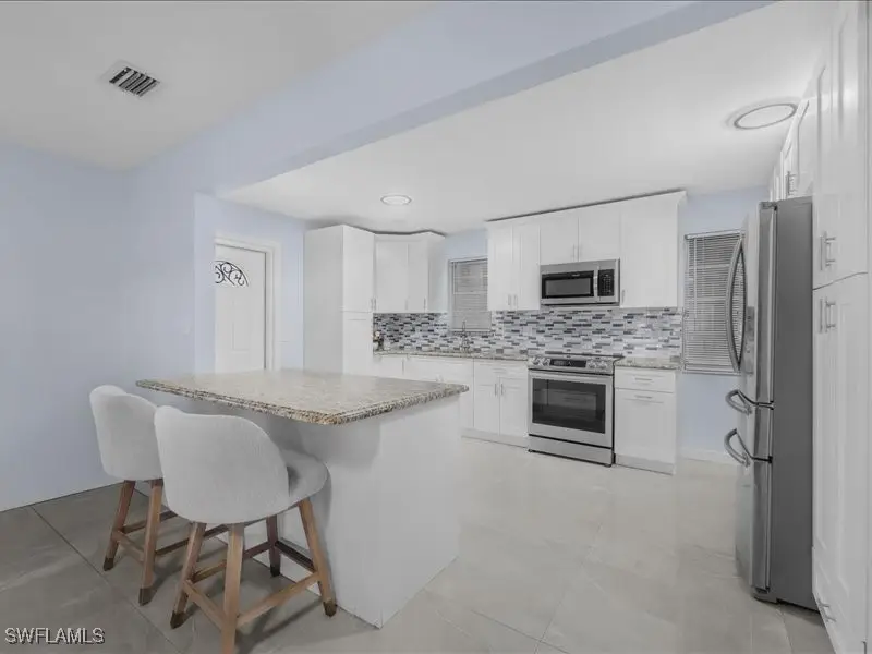 77 Glenmont Drive W, North Fort Myers, FL 33917 - Image #1