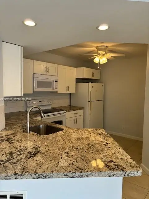 8977 Wiles Road #103, Coral Springs, FL 33067
