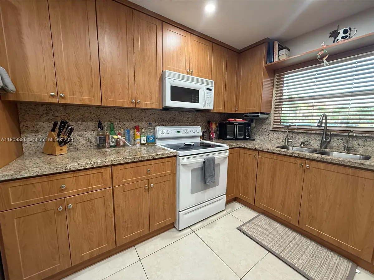 9741 Sunrise Lakes Blvd #107, Sunrise, FL 33322 - Image #1